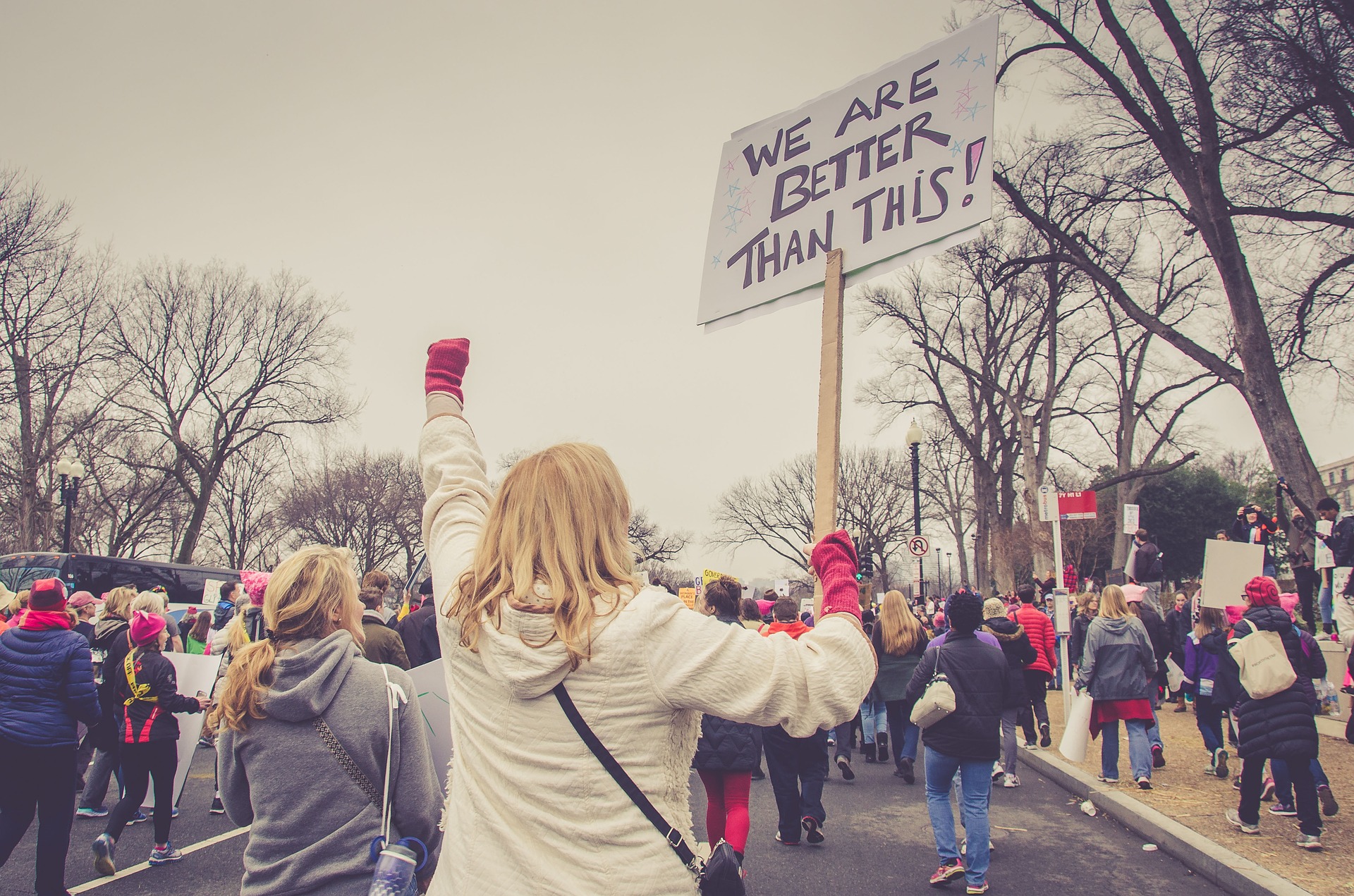 woman with sign at rally
