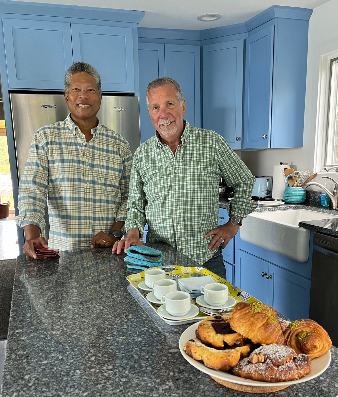 Randal Rucker and Jim Becker standing side-by-side in their kitchen.