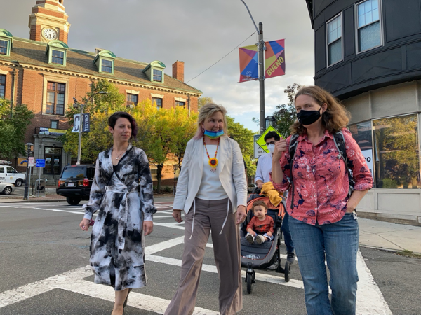 Roberto Jimenez, Caroline Ellenbird, Beth Anderson, Stella Dubsih walking across a crosswalk in Chelsea.
