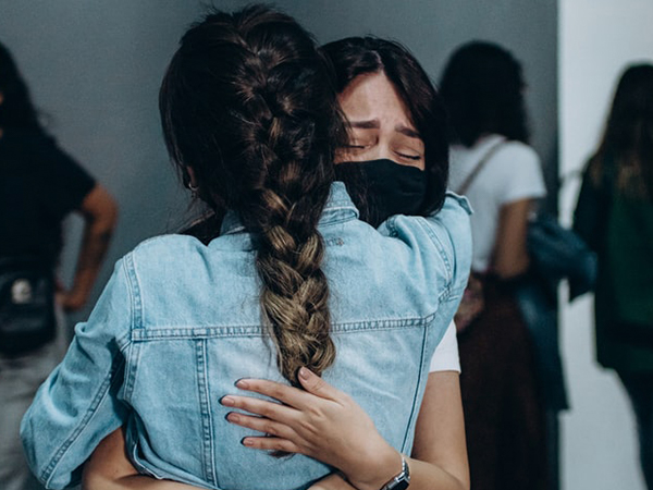 Women hugging in support of each other
