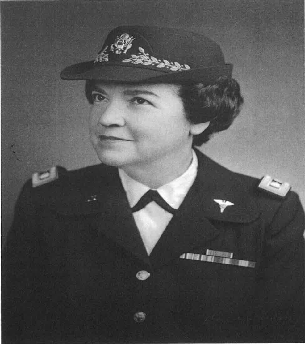Black and white headshot of Ruby Linn. She is wearing a military uniform, smiling.