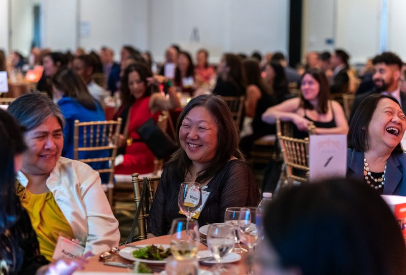 ACF 2024 Gala attendees laugh at a table