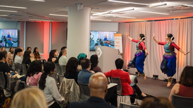 Performers dance onstage at the Making Waves report release event in June 2025
