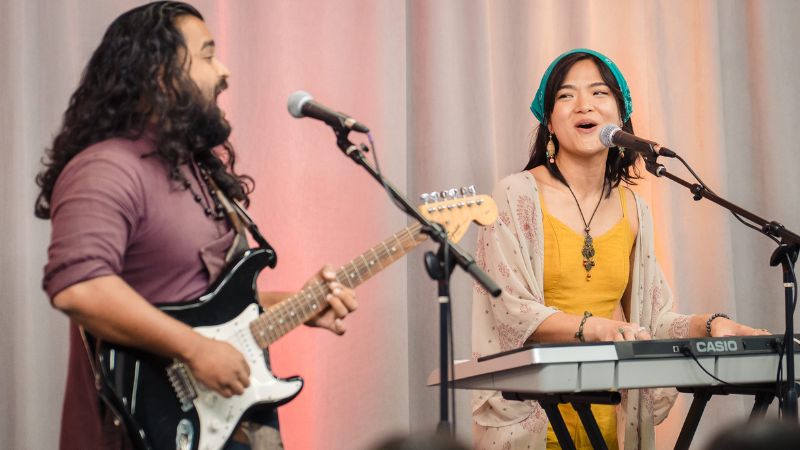 A duo of musicians perform onstage at the Making Waves report release event in June 2025