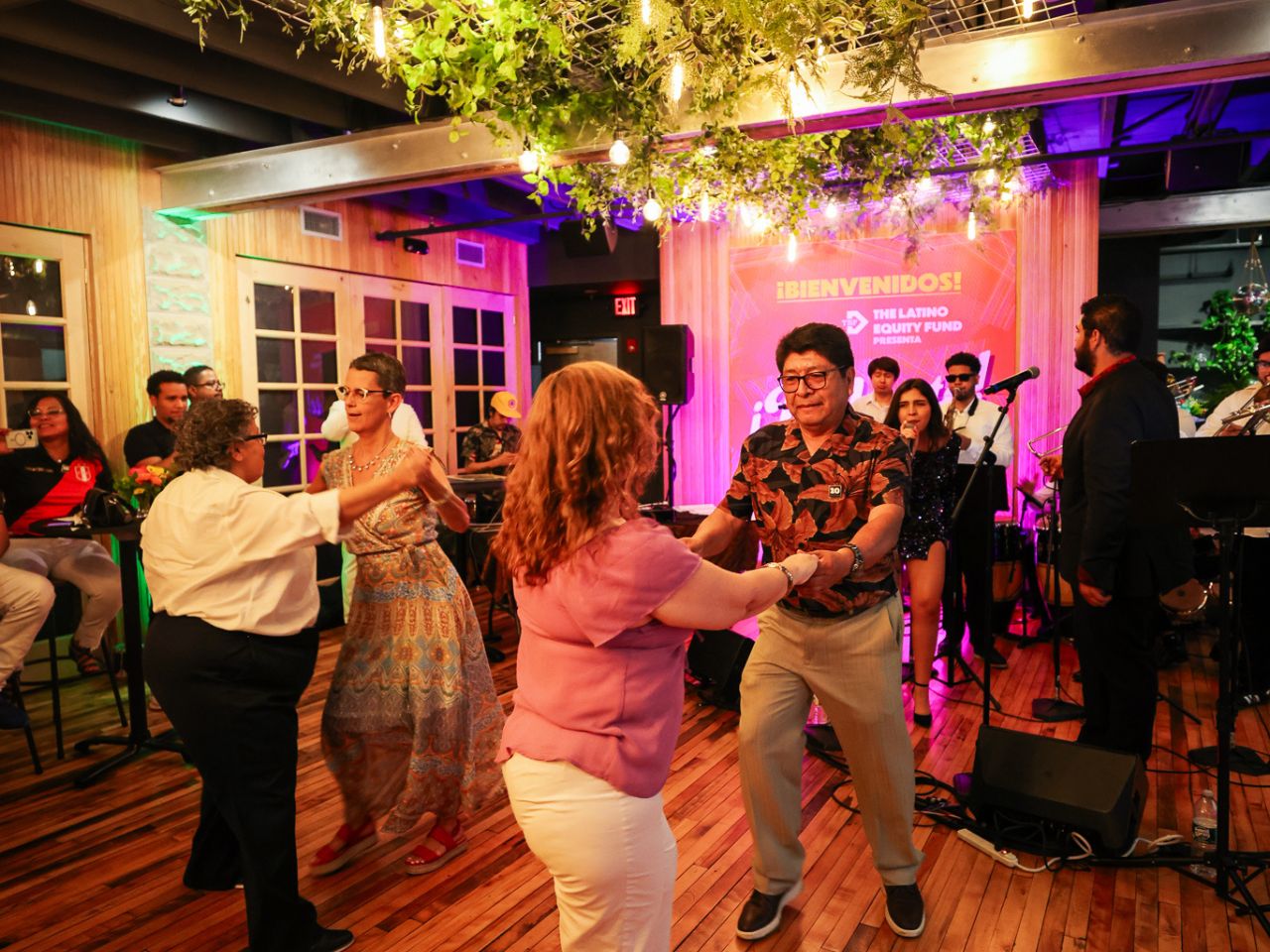 A group of people dance during the Pa'lante event at Bow Market