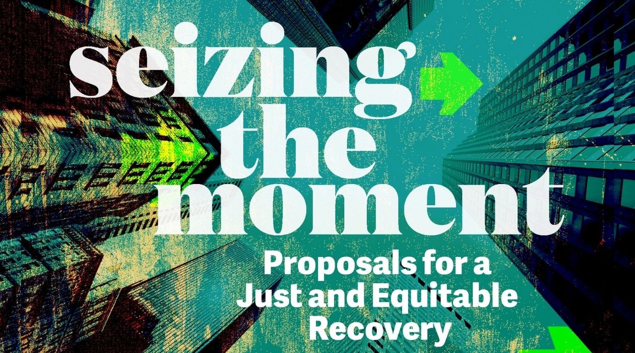 A black, green, and blue colorized photo of a looking-up view of city buildings. White text reading "seizing the moment: Proposal for a Just and Equitable Recovery" superimposed on it.