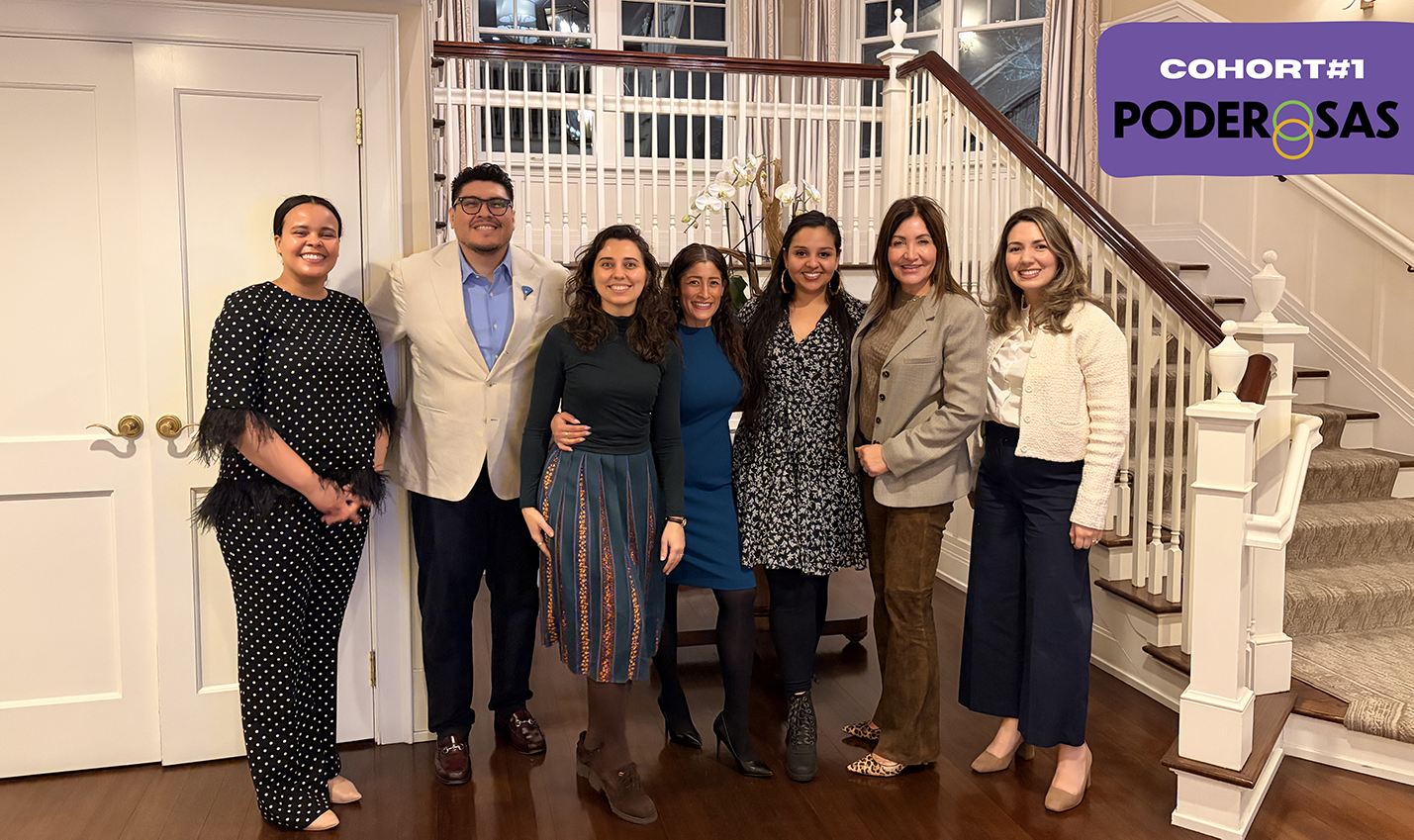 Group photo of Poderosas cohort 1, the group stands at the bottom of a staircase