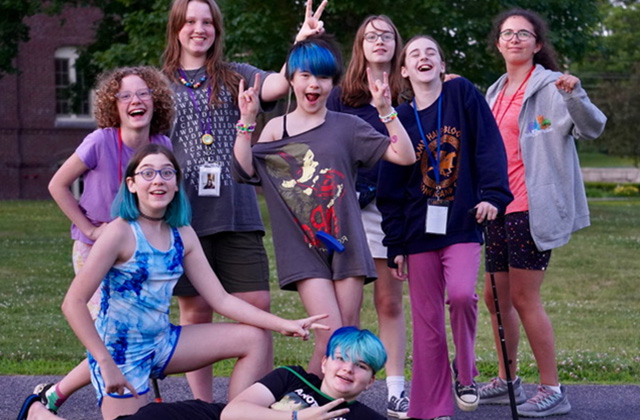 A group of campers pose for a silly photo