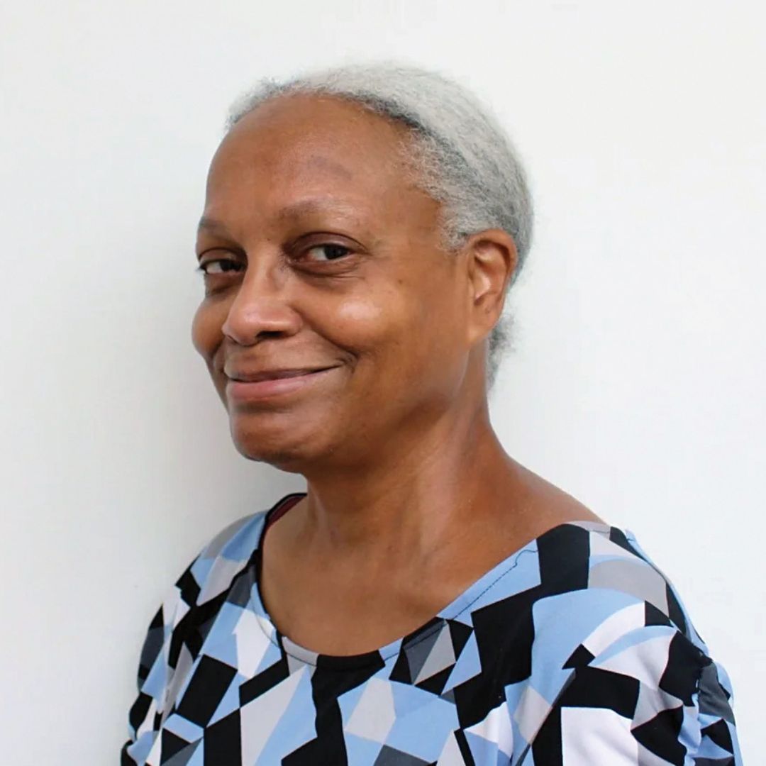 Connie Forbes, an nolder black woman with silver hair tied back