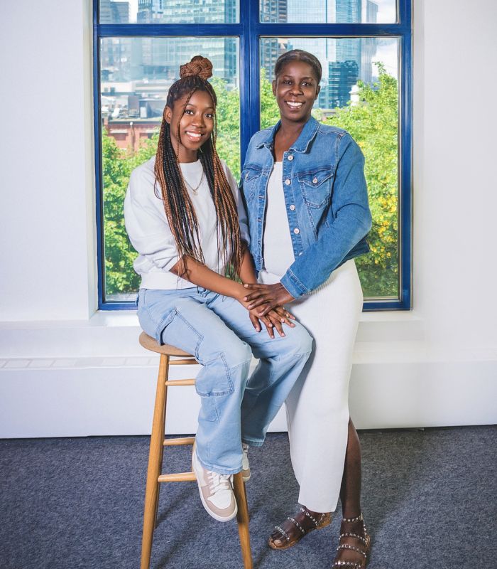 Black Refugee and Immigrant Community Coalition family portrait session photo of a family with a mom and teenage girl