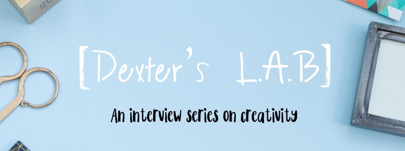 White text on a blue background says "Dexter's L.A.B." Smaller black text beneath that says "an interview series on creativity." Around the edges of the image are various arts and crafts supplies.