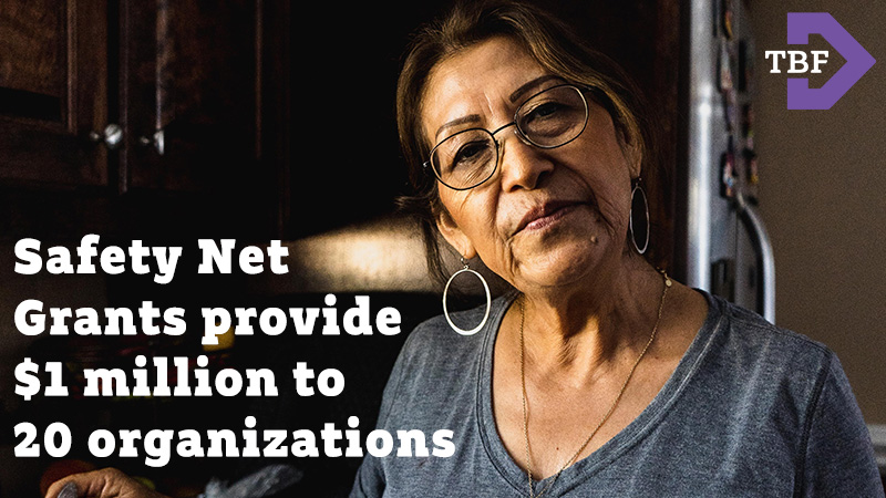 Safety Net Grants provide $1 million to 20 organizations. Photo of an older Latina woman standing in her kitchen