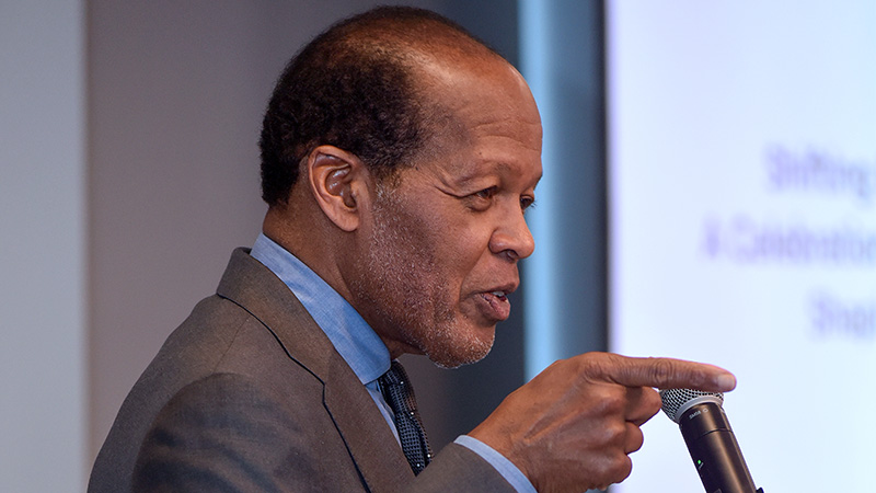 Lee Pelton gives remarks onstage at a TBF event