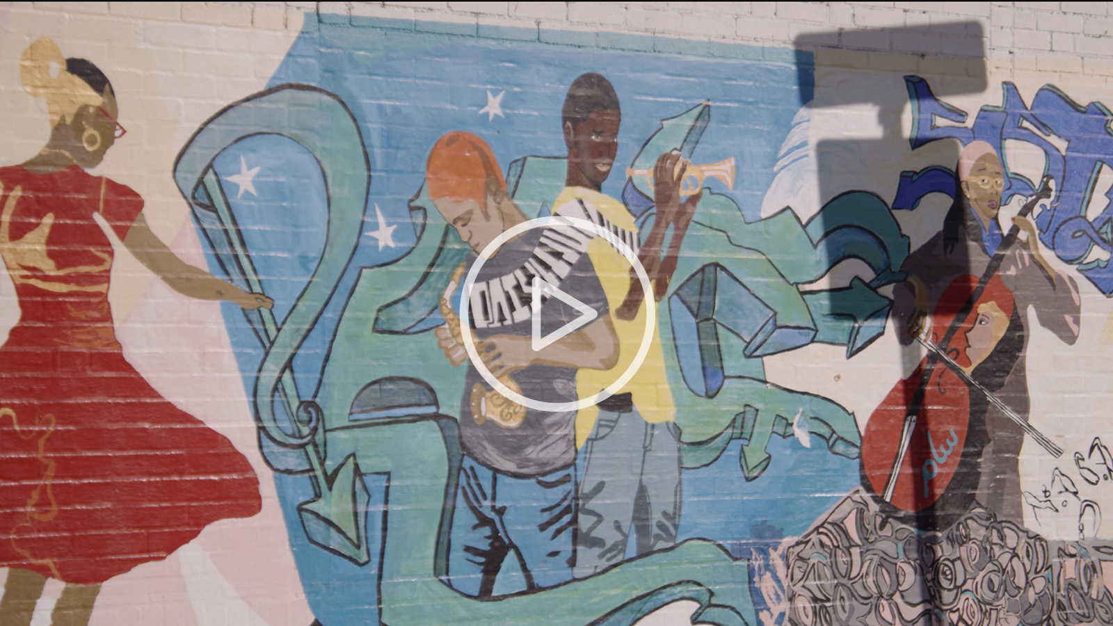 East Boston mural and arts with play button